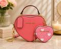Michael Kors heart shaped handbag in coral pink with gold hardware and matching MK monogram coin purse with white hearts