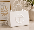 Telfar Shopping Bag in white vegan leather with tonal embossed logo and detachable shoulder strap