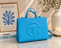 Telfar Shopping Bag in sky blue vegan leather with tonal embossed logo and detachable shoulder strap