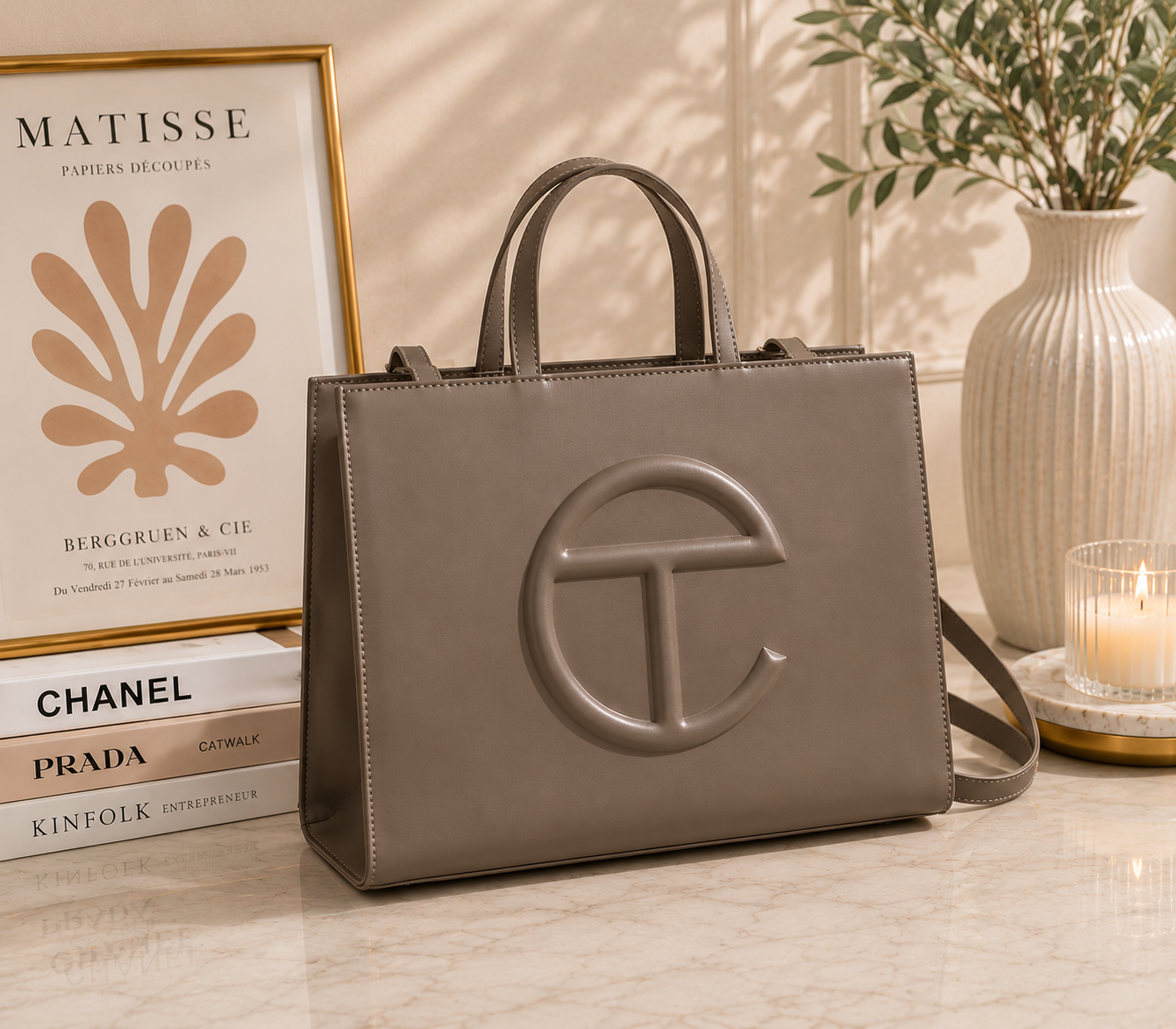 Telfar Shopping Bag in taupe greige vegan leather with tonal embossed logo and detachable shoulder strap