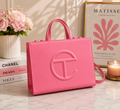 Telfar Shopping Bag in bubblegum pink vegan leather with tonal embossed logo and detachable shoulder strap