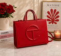 Telfar Shopping Bag in scarlet red vegan leather with tonal embossed logo and detachable shoulder strap