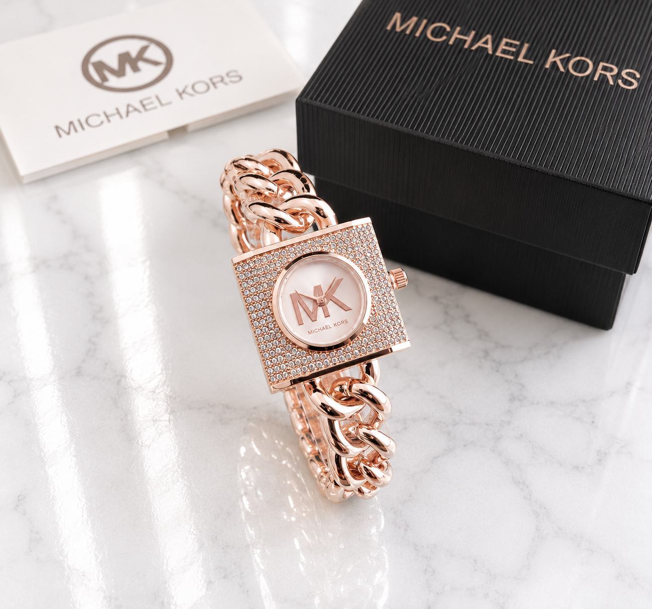 Michael Kors pavé crystal square lock watch in rose gold with blush pink dial on rose gold Cuban chain bracelet with MK logo and gift box