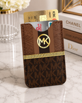 Brown MK monogram card holder with dual pockets and gold chain accent detail