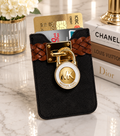 Black denim MK card holder with braided tan leather strap and gold MK lock charm