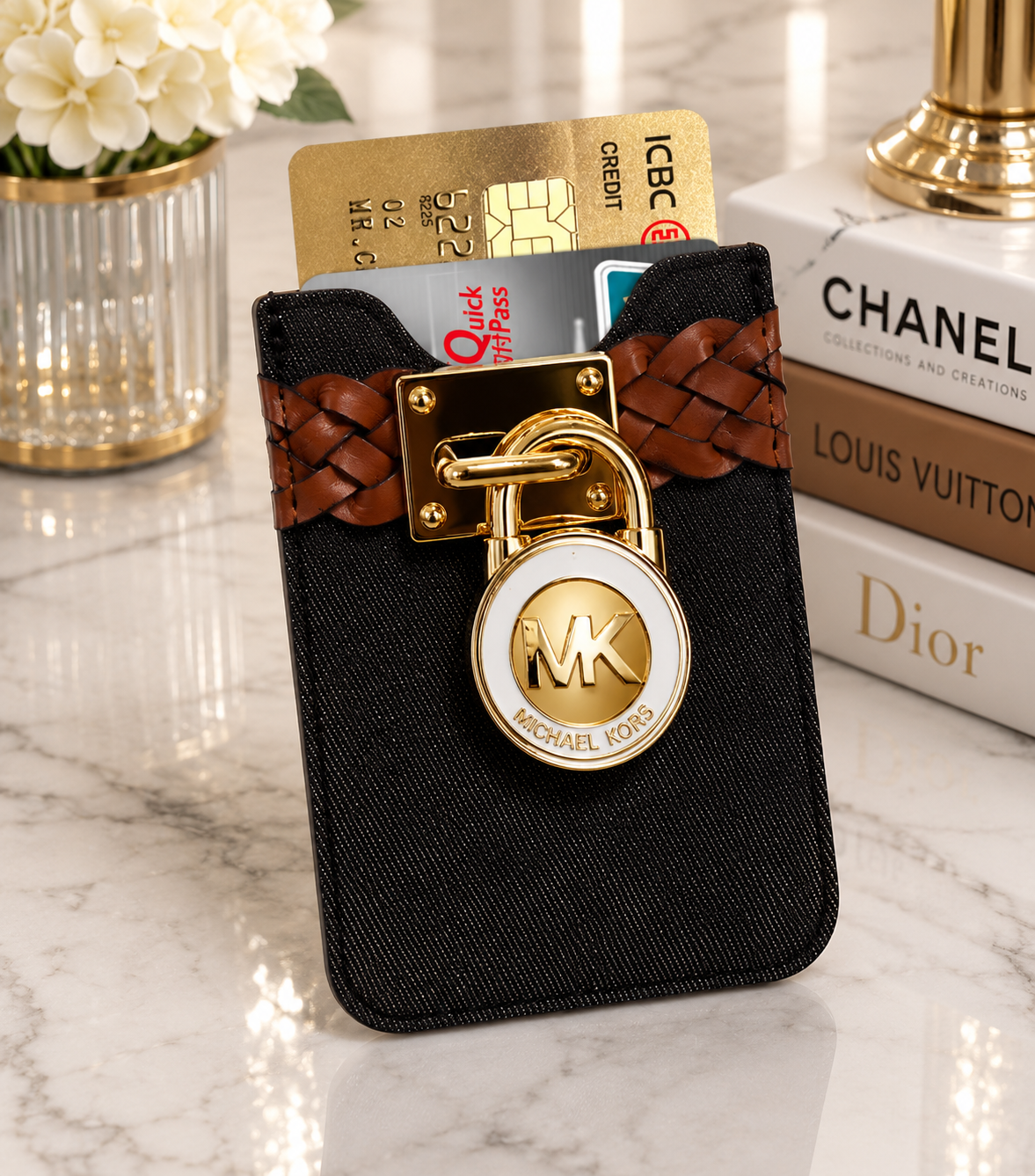 Black denim MK card holder with braided tan leather strap and gold MK lock charm