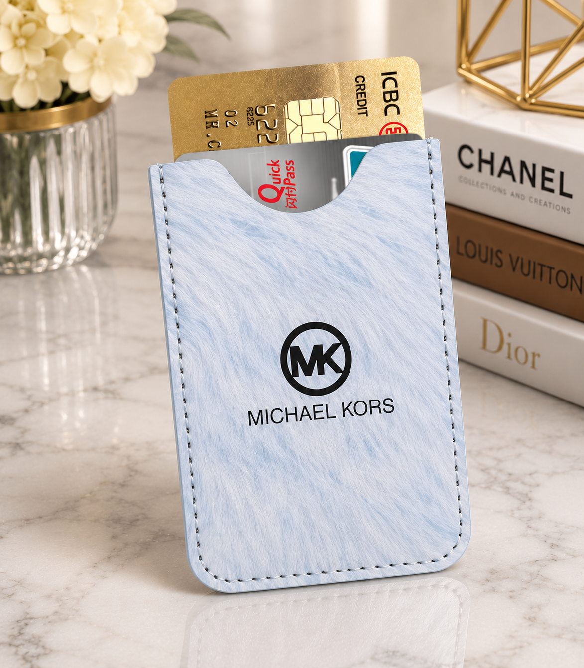 Light blue marble texture MK card holder with black MK logo and Michael Kors branding