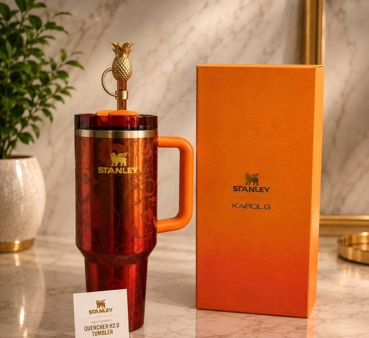 Stanley x Karol G Quencher H2.0 40oz Tumbler with gold pineapple topper and orange gift box