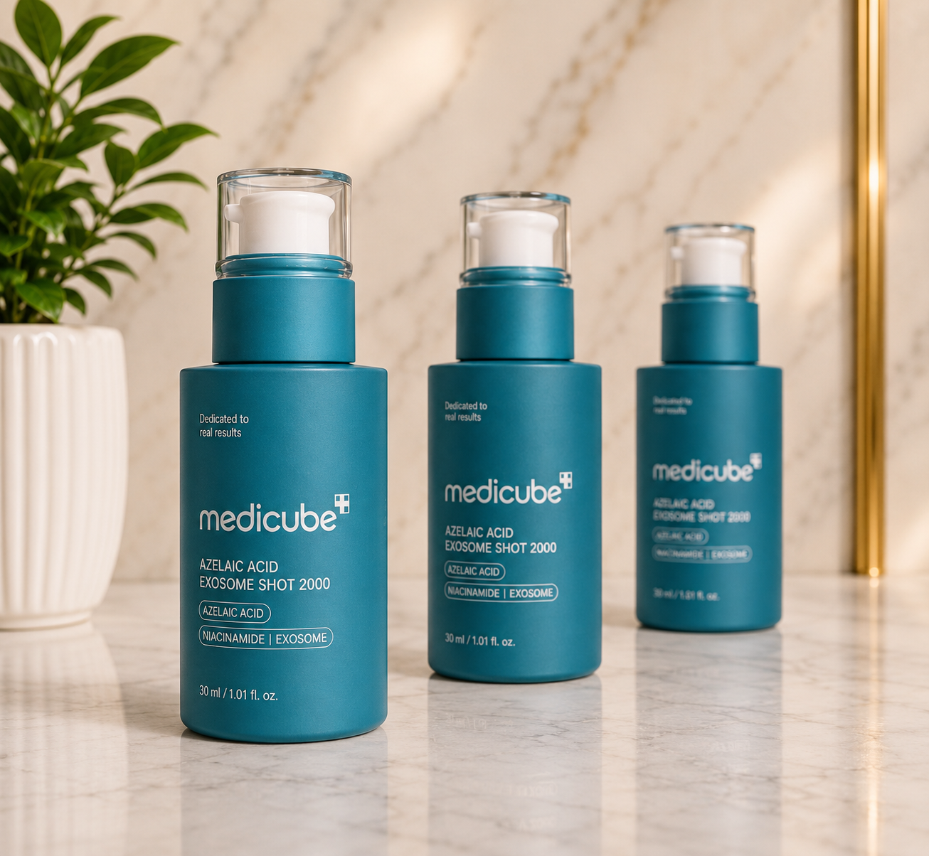 Medicube Azelaic Acid Exosome Shot 2000 PPM 3-piece set in teal pump bottles on marble surface