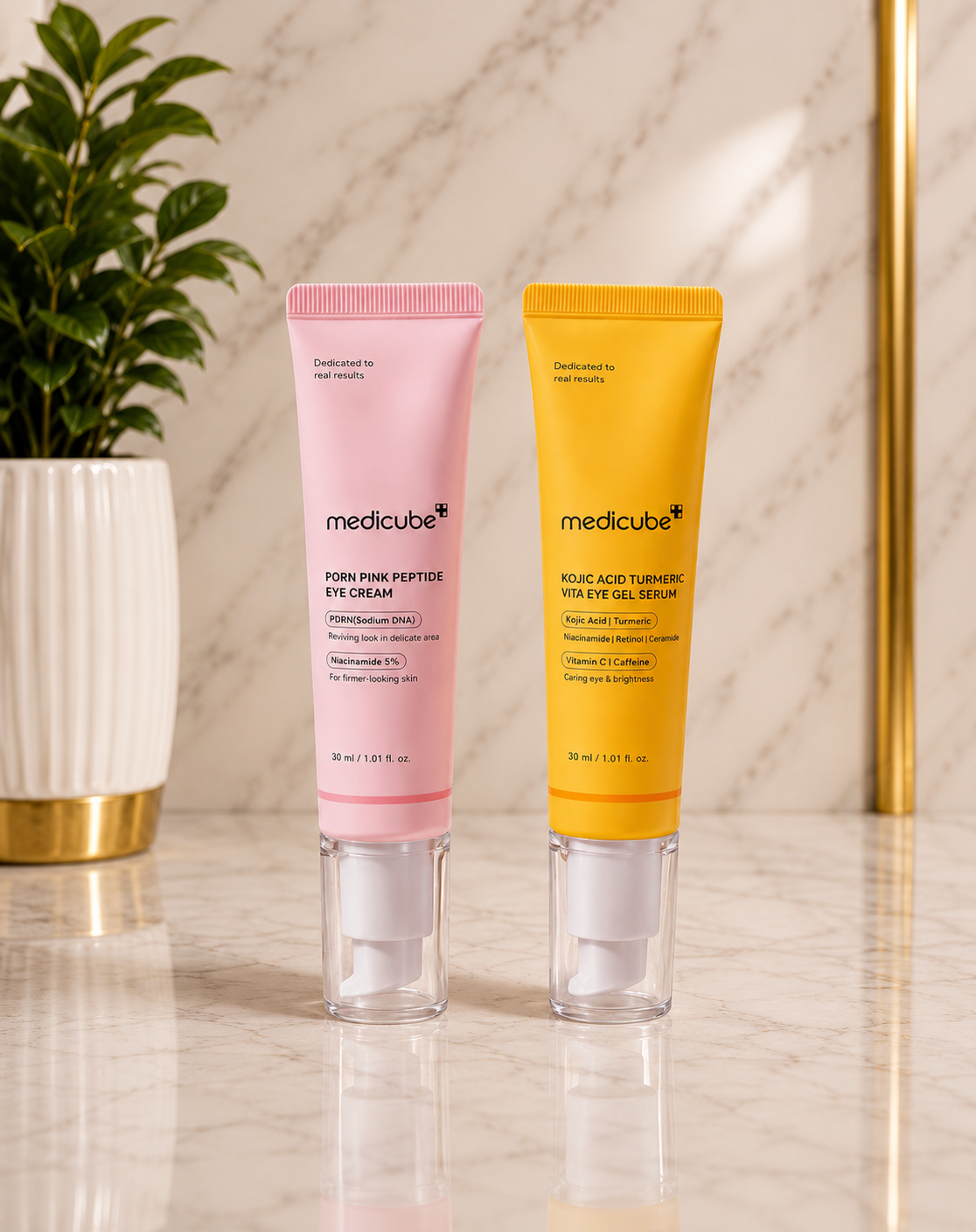 Medicube PDRN Pink Peptide Eye Cream and Kojic Acid Turmeric Vita Eye Gel Serum 2-pc set on marble surface