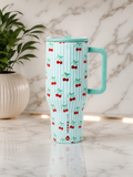 HydroJug Cherry Stripe 40oz Tumbler with mint handle and cherry print on marble surface