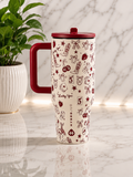 HydroJug Lucky You Western Print 40oz Tumbler with burgundy handle and cream western icon print on marble surface