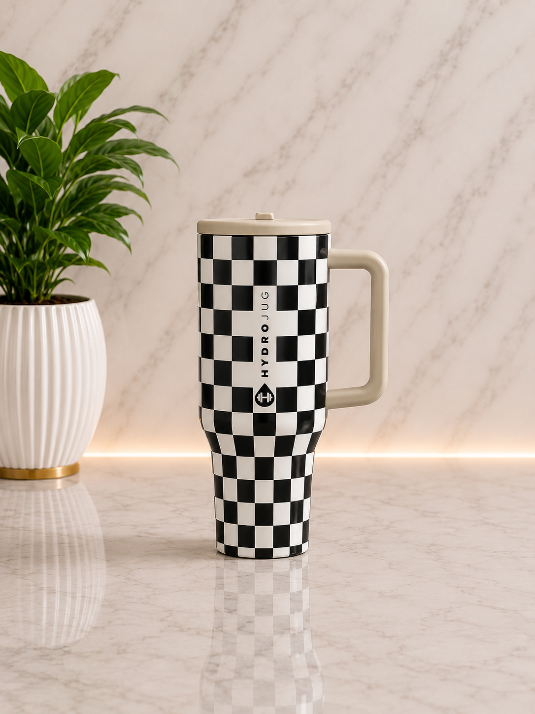 HydroJug Black and White Checker 40oz Tumbler with cream handle and lid on marble surface