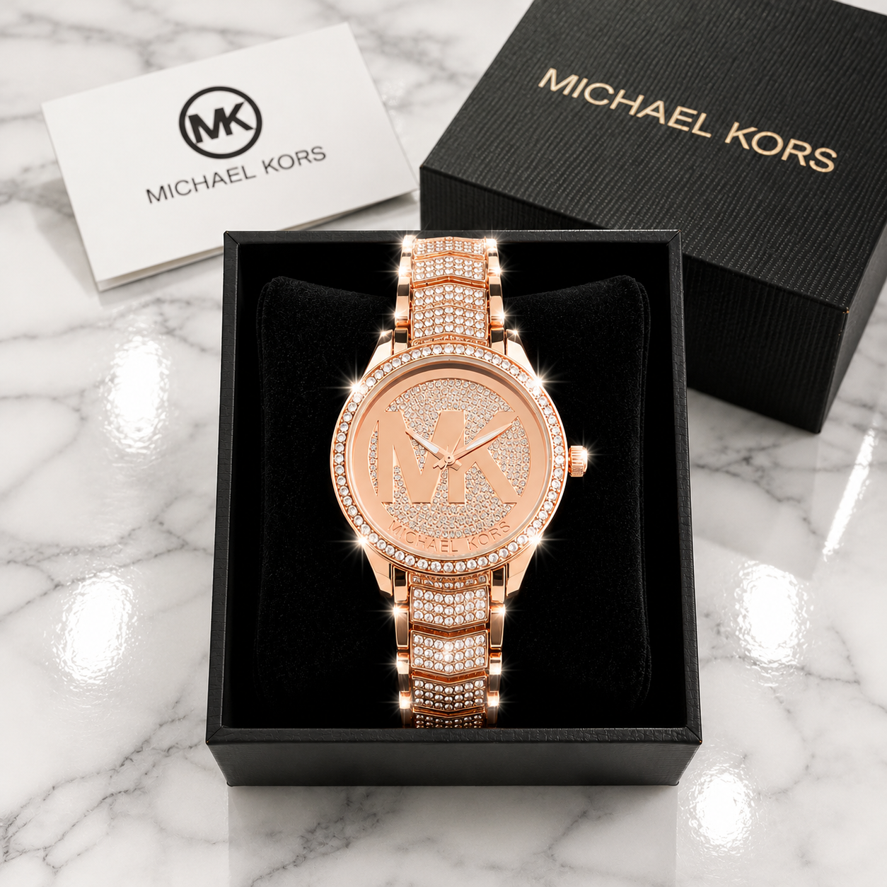 Michael Kors Ladies Quartz Watch all rose gold with pave MK logo dial and full crystal bracelet in luxury gift box on marble surface