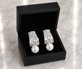 CZ Baguette and Pearl Drop Earrings in silver displayed in a black luxury gift box