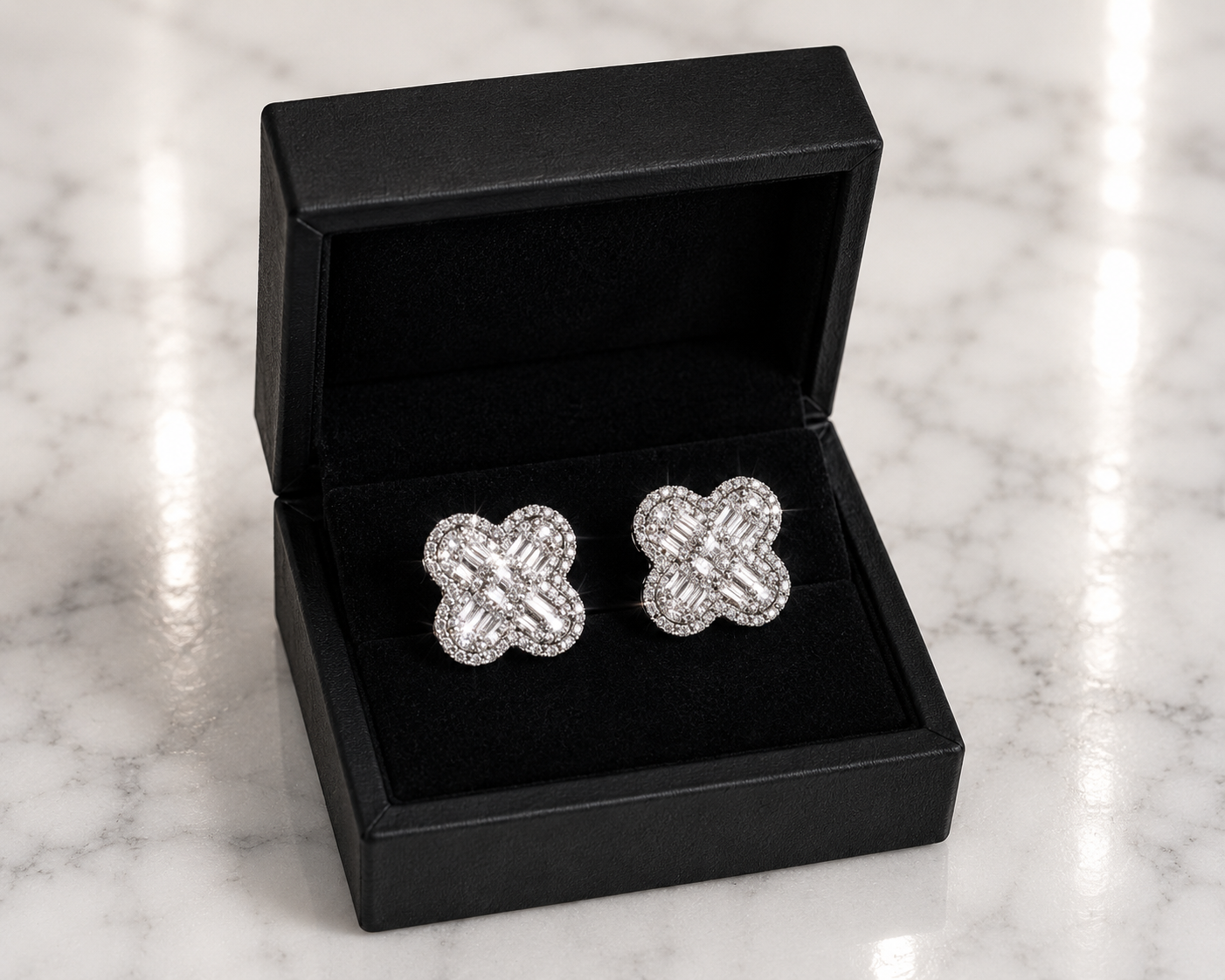 CZ Baguette Clover Stud Earrings in silver displayed in a black luxury gift box