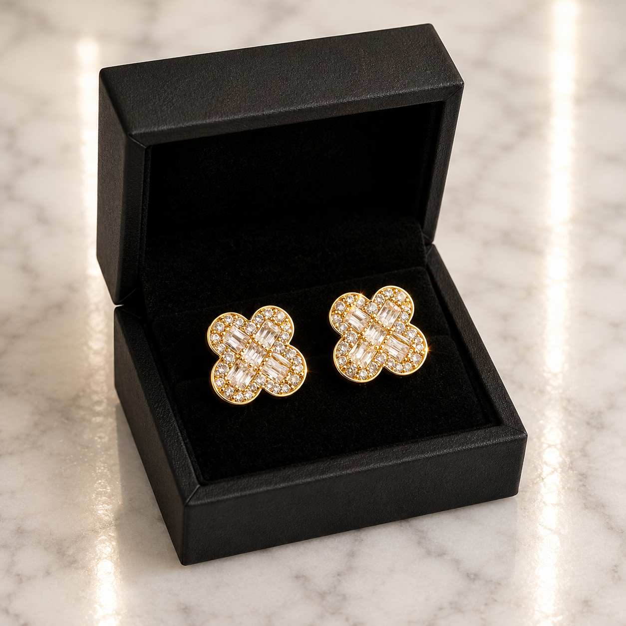CZ Baguette Clover Stud Earrings in 18K gold tone displayed in a black luxury gift box