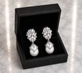 CZ Cluster and Pearl Drop Earrings in silver displayed in a black luxury gift box