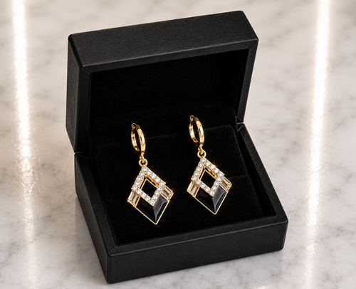 Black Onyx and CZ Diamond Huggie Drop Earrings in 18K gold tone displayed in a black luxury gift box