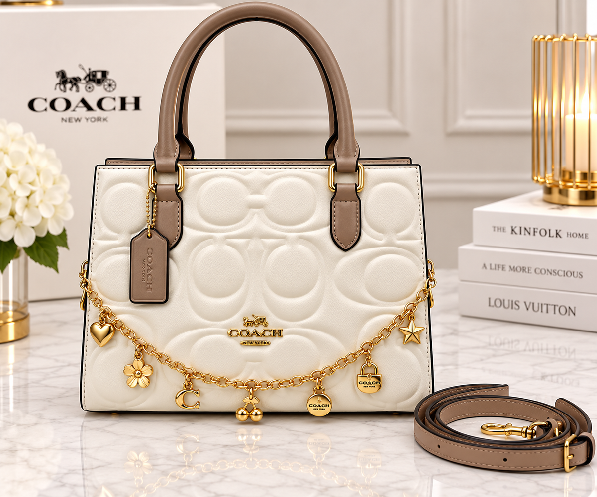 Coach white signature embossed leather tote bag with taupe leather trim, gold charm chain and detachable strap